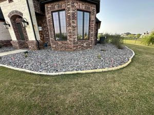 Transform your outdoor space with our premium gravel service, offering a variety of colors and sizes to enhance pathways, driveways, and gardens for durability and aesthetic appeal. for Fine Line Lawn Care & Landscaping in Aledo, TX