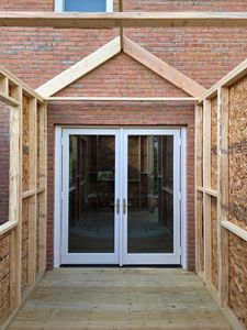 Our Door Installation service enhances your home's functionality and aesthetics, seamlessly integrating with deck & patio installation projects to create inviting indoor-outdoor transitions for an improved living experience. for Murphy's Tech & Trade in Newport, NH