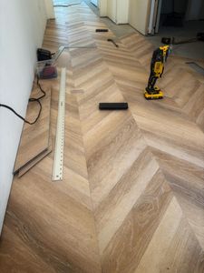 Our flooring installation service ensures a perfect blend of style and durability, offering homeowners expertly installed hardwood, tile, or carpet solutions that enhance the beauty and functionality of every room. for Apex Construction & Remodel in Grove, OK