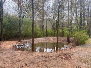 In order for your detention pond to function property it is important to keep the nearby vegetation under control and remove excess sediment. We offer full service detention pond maintenance. for Fayette Property Solutions in Fayetteville, GA