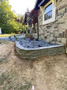 Our Retaining Walls service offers homeowners a way to keep their property looking its best by installing retaining walls that will hold back soil and protect against erosion. for Dust Till Dawn Lawn in London, Kentucky
