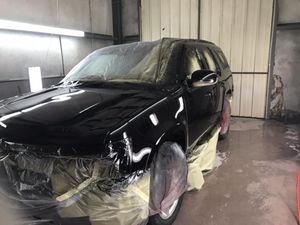 Our Paint Coating service is a protective coating that we apply to your car's paint job. It helps keep your car looking new by protecting it from the sun, weather, and other elements. for Finley Paint Body and Towing in Lanett, AL