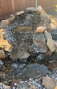 We offer a Waterfall Feature Installation service to create a tranquil and serene backyard environment for homeowners. for Platinum Landscape Design LLC in San Angelo, Texas