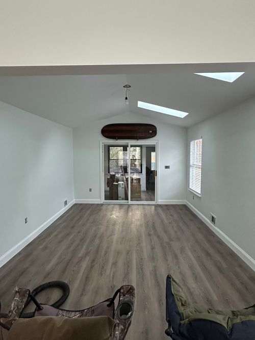 Gray plank flooring in an open room