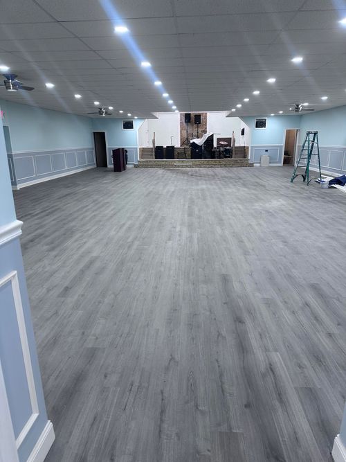 Gray plank flooring in a large hall
