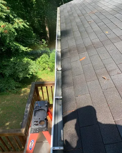 Our gutter cleaning service is a great way to keep your home's gutters clean and free of debris. We use high-pressure water to clean the gutters, and we can also clear any blockages in the downspouts. for Oakland Power Washing in Clarksville, TN