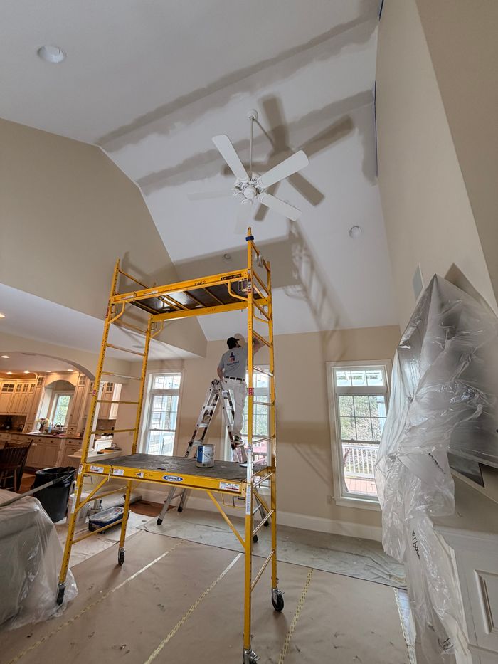 Rolling staging set up for a tall ceiling