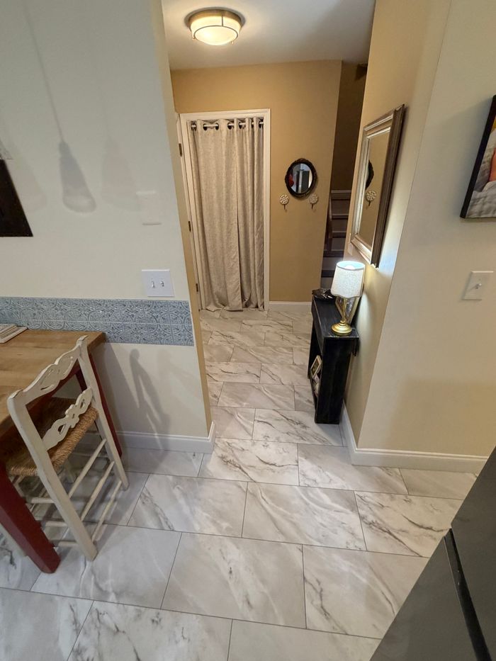 Marble look tile floor in an entry