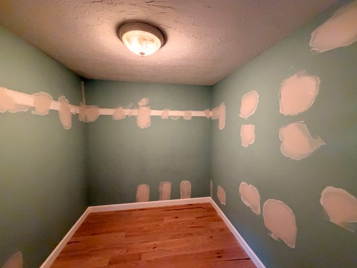 Room with walls patched before painting