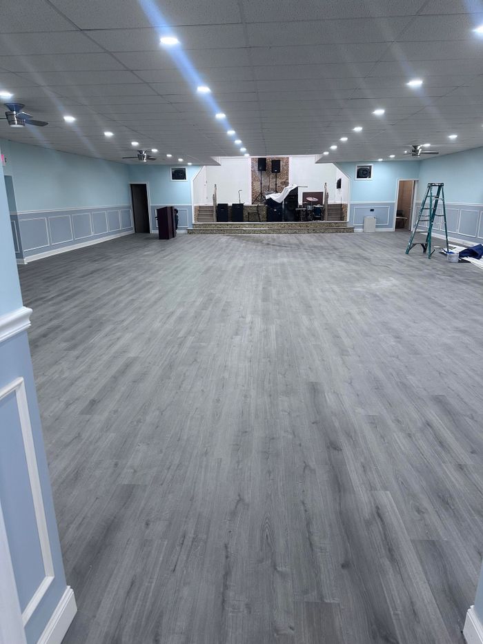 Gray plank flooring in a large hall