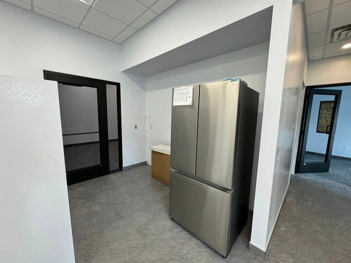 Remodeled interior room with new flooring and walls