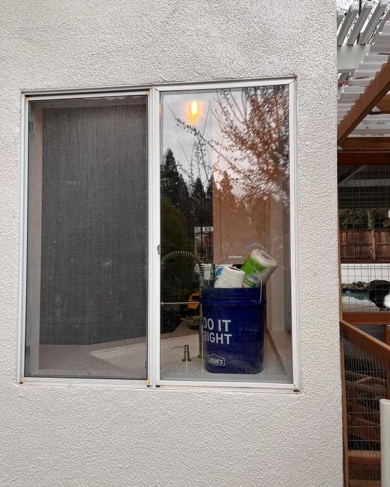 Replacement sliding window on a stucco home