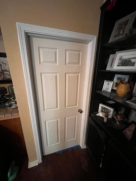 New white six-panel interior door with fresh trim