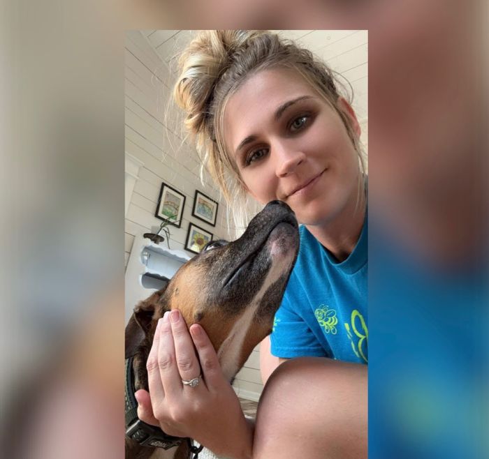 Busy B's team member with a friendly dog