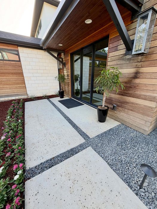 Modern entry paver walk with gravel joints and flowers