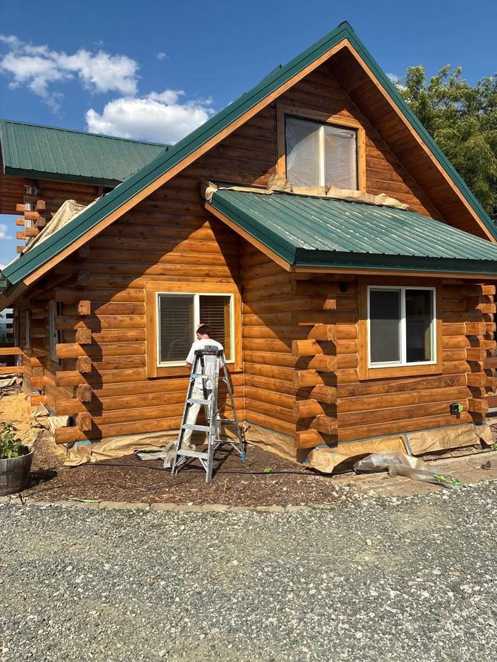Amber stain on a log home in Mead, WA