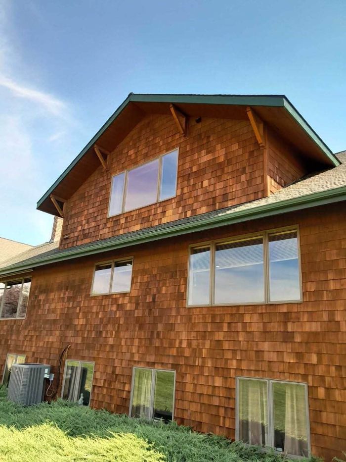 Dark walnut stain on a log home in Inchelium, WA