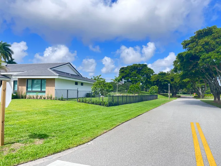 Lawn maintenance: freshly edged lawn along a residential street in Palm Beach County
