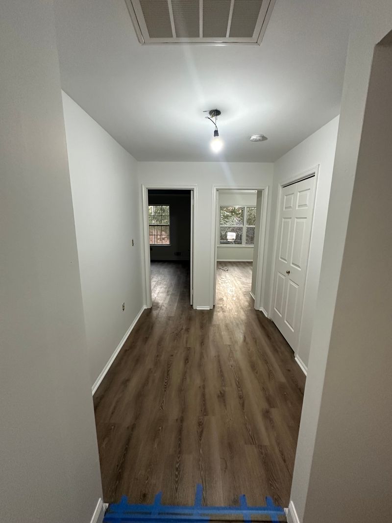 Gray plank flooring in a hallway