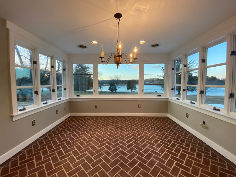Sunroom with brick floor