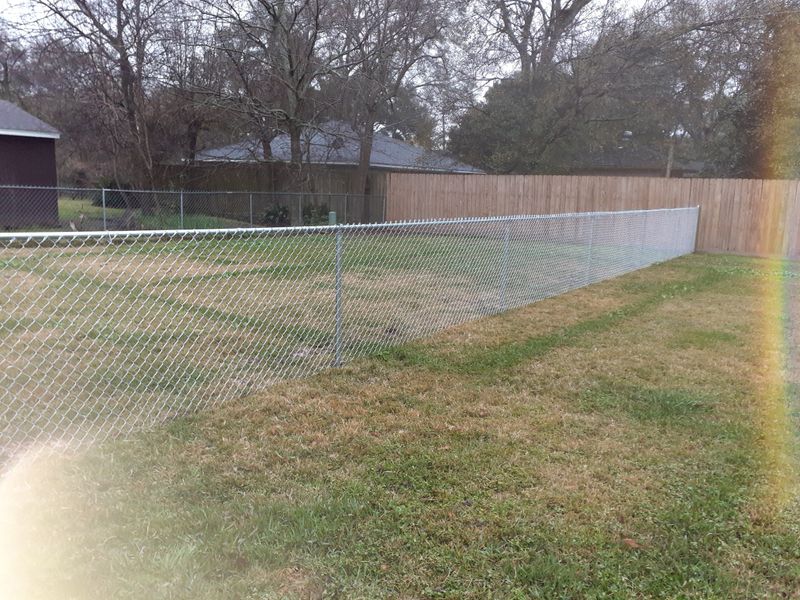 Long fence line across an open field
