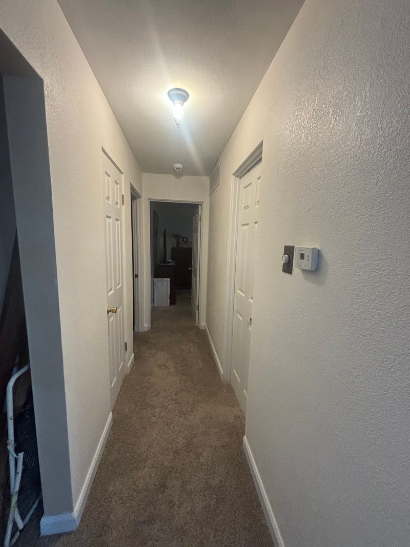 Painted residential hallway with new carpet
