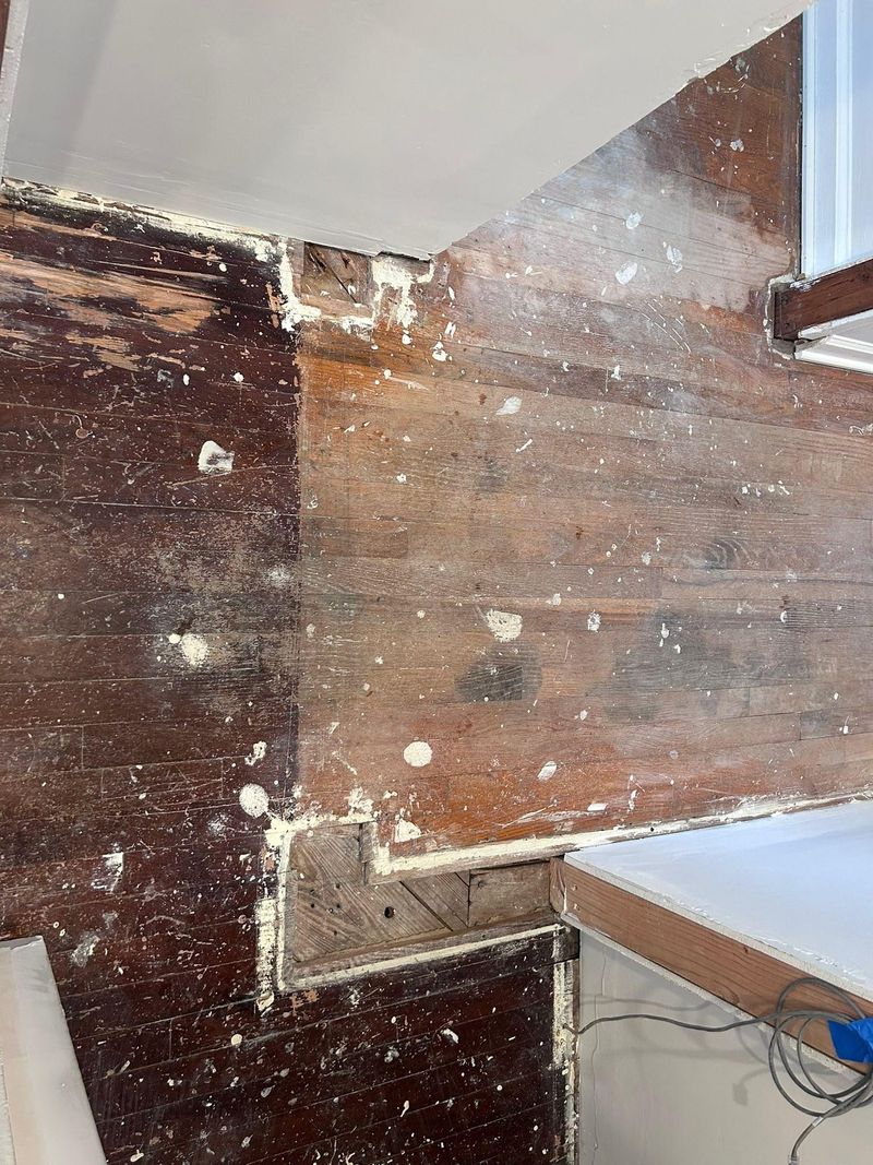 Old flooring opened up before a repair