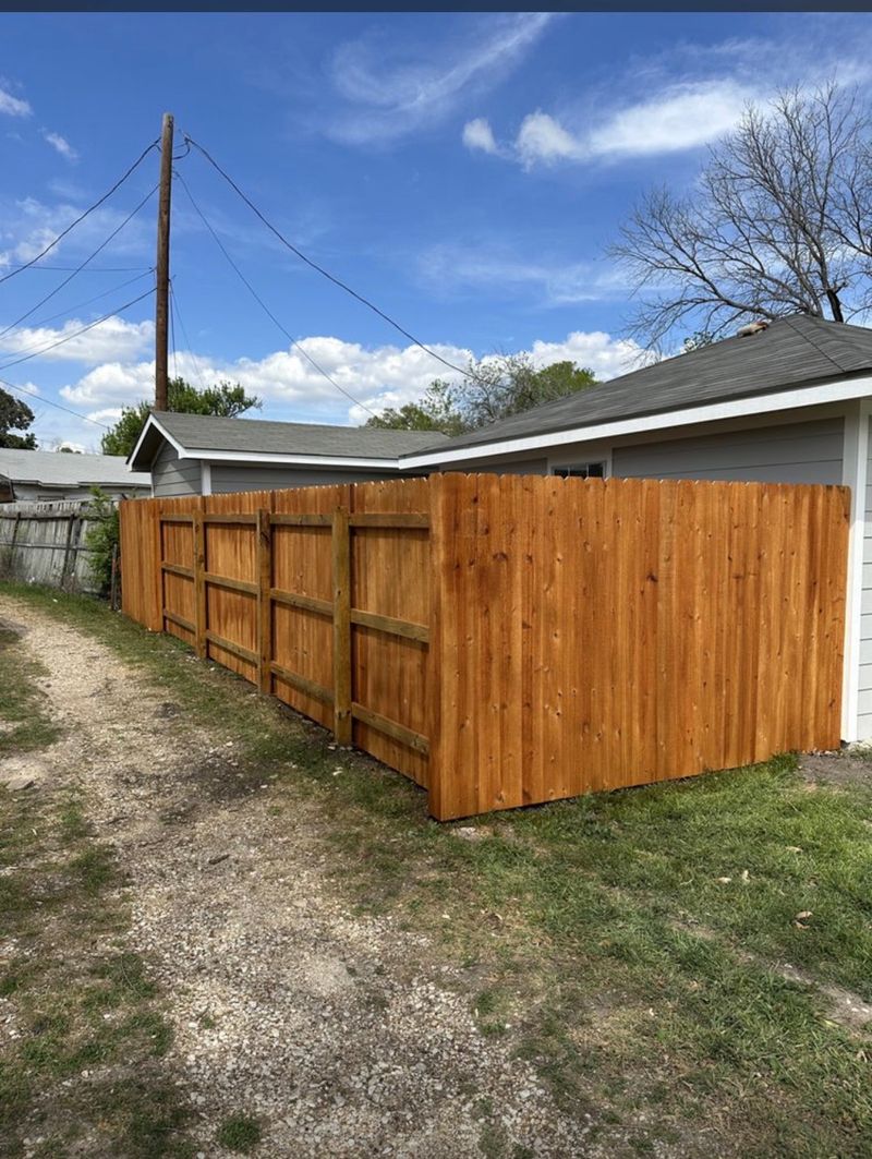 Stained cedar with a walk gate, alley side