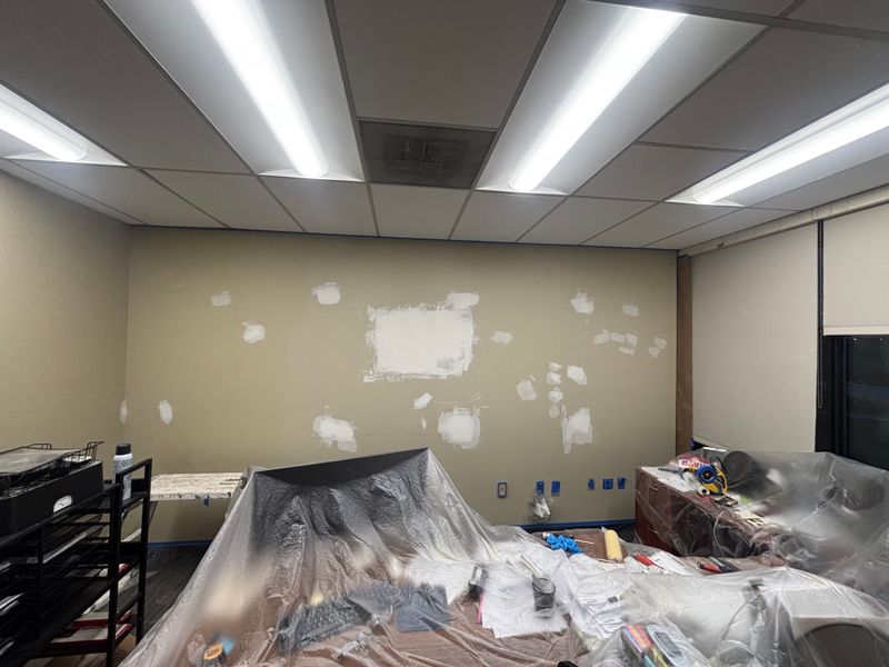 Office wall with sheetrock patches before finishing