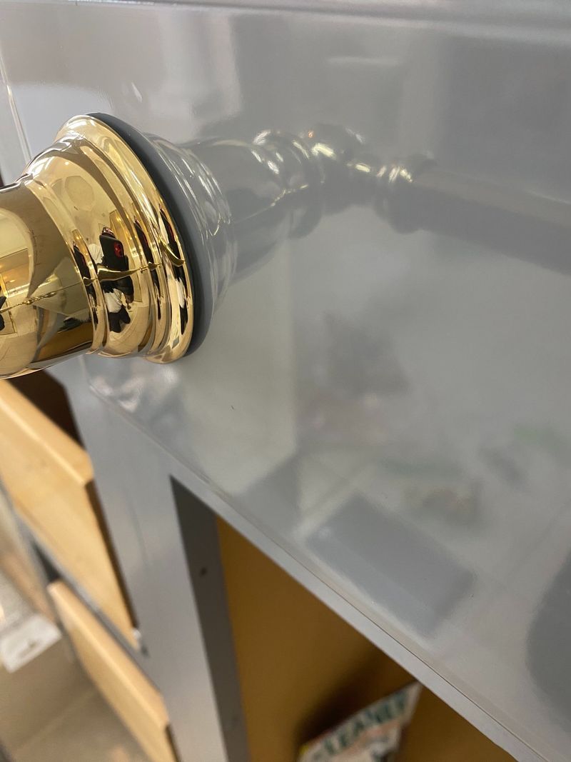 Brass knob on a gloss door