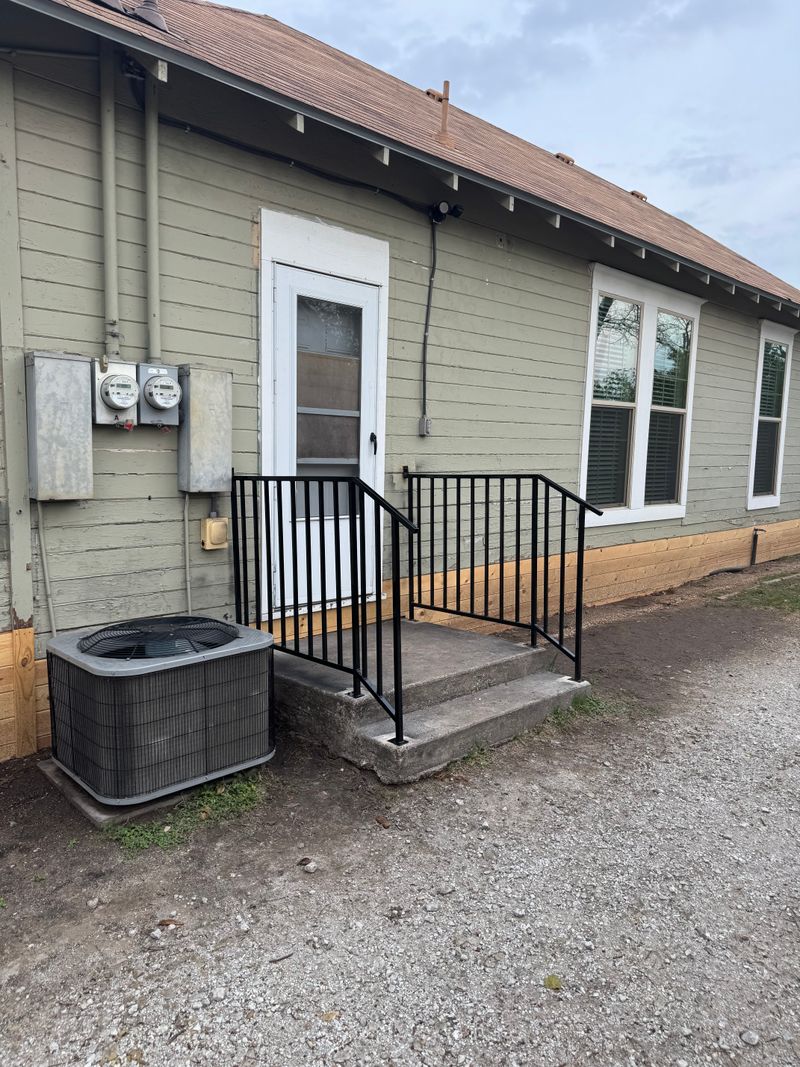 Back-door stairs with iron rails