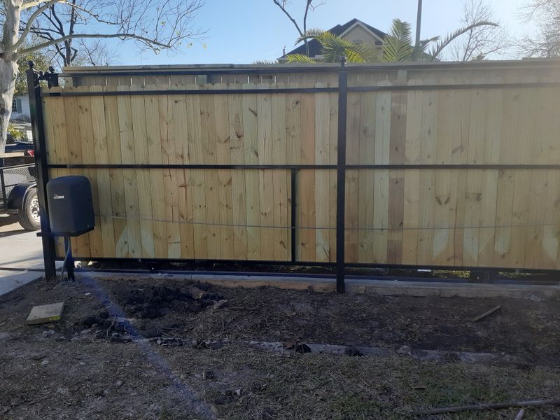 Wood slide gate on a steel frame with an automatic operator