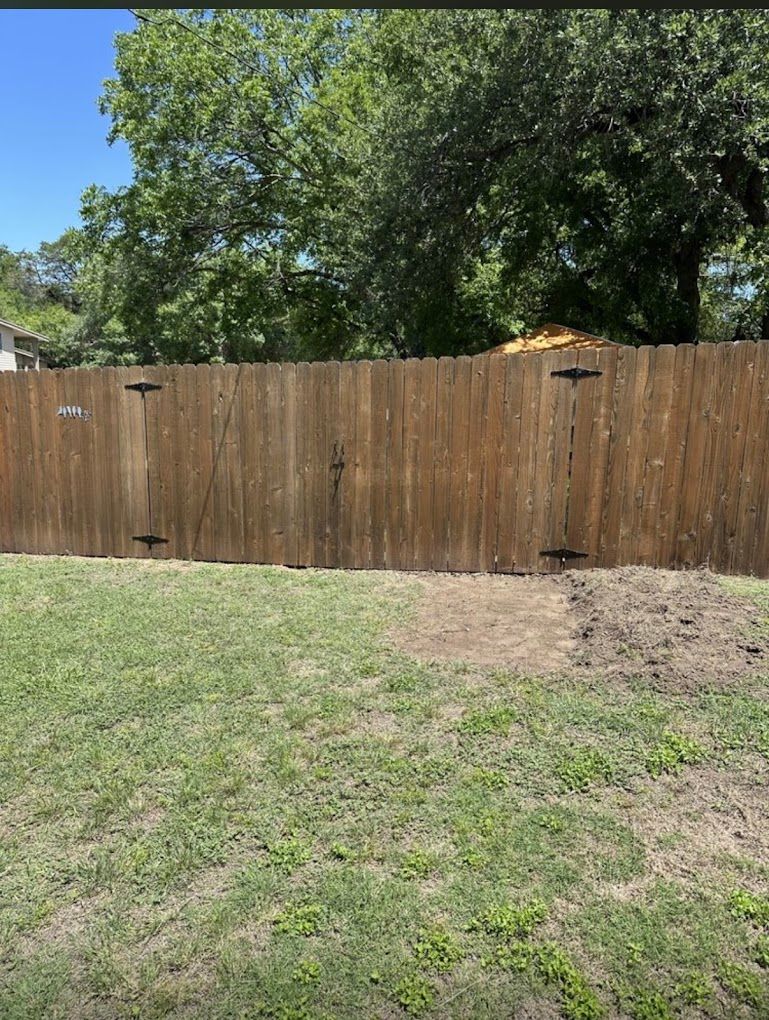 Cedar fence and gate under trees
