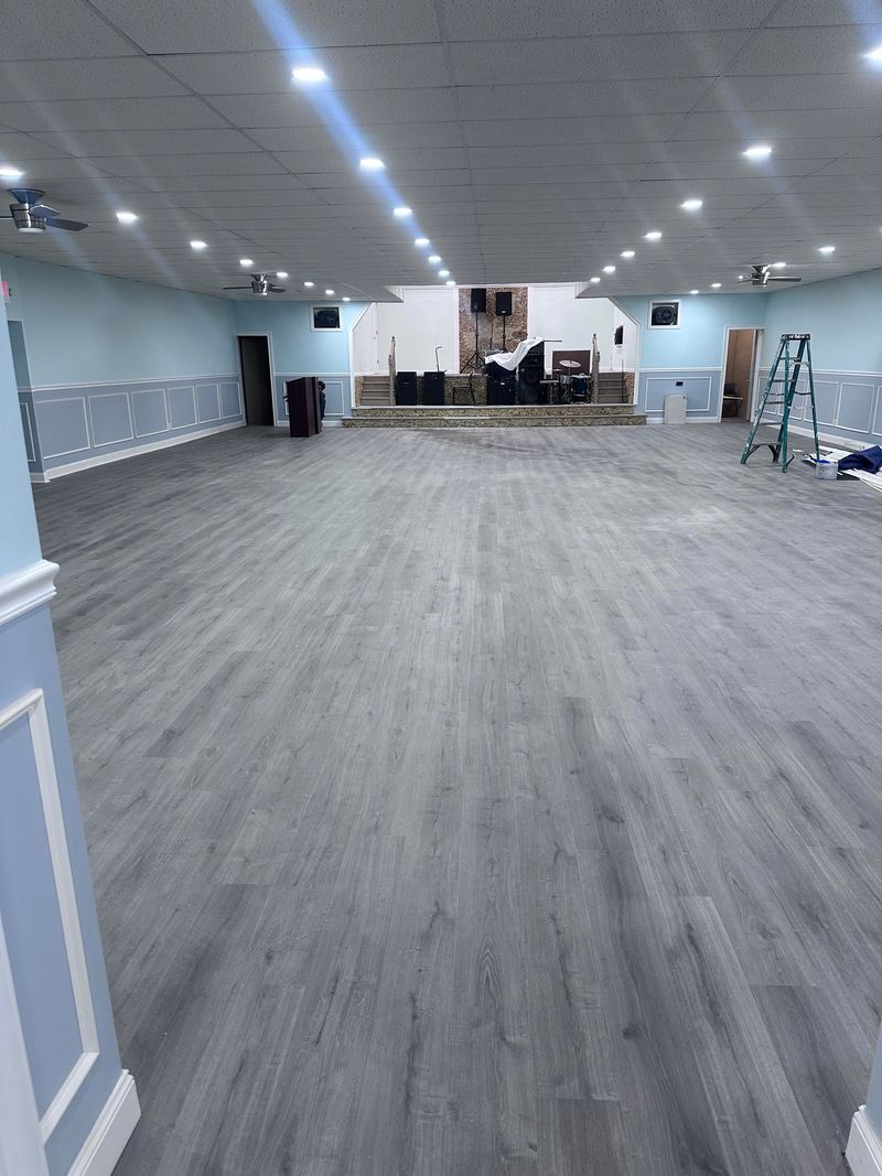 Gray plank flooring in a large hall