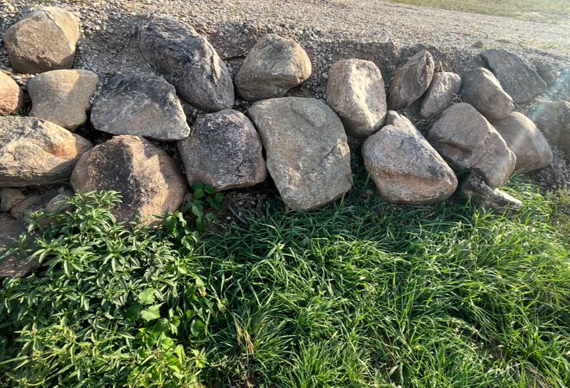 Transforming Terrain: JMB Lawn and Landscape's Stunning Stonewall Solution