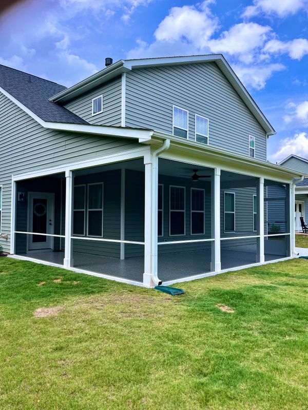 "Transforming Outdoor Living: A Stunning Screened Porch Addition by Cool Hand Home Improvements"