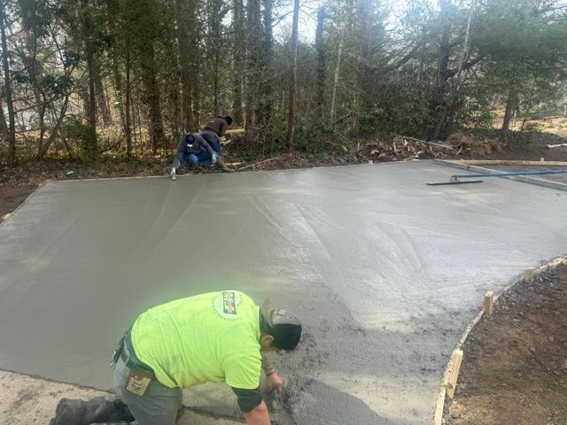 Seamless Transformations: Expert Concrete Driveway Installation by Outdoor Assassins LLC