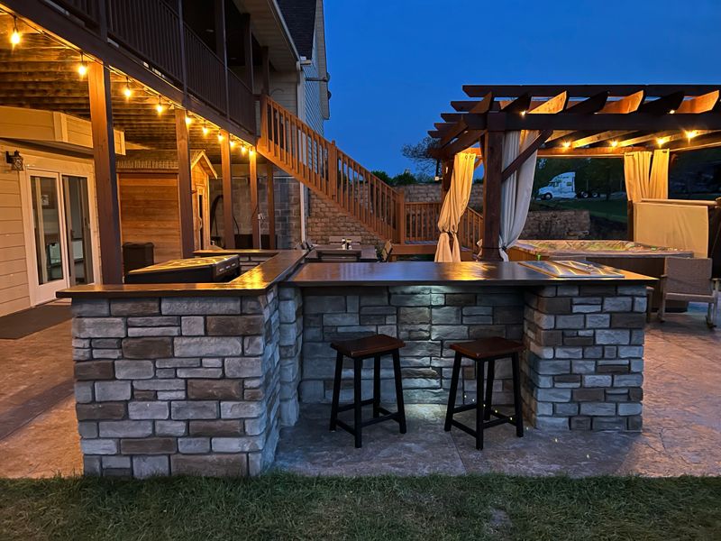 Outdoor kitchen and living spaces.