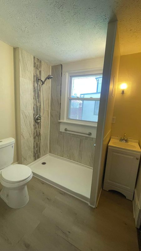 Finished bathroom with a new toilet