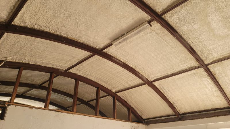 Arched quonset ceiling finished in spray foam