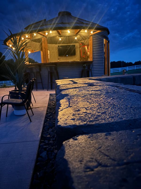 Outdoor kitchen and living spaces.