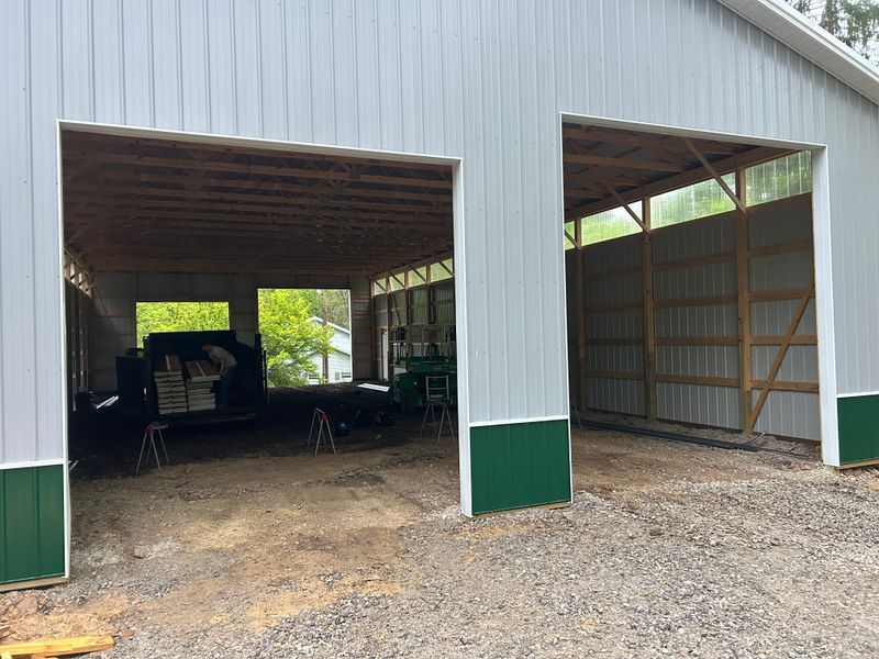 Large Barn Door Installation in Progress on a New Build