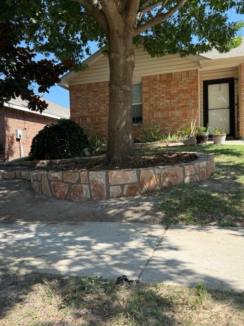Expertly Crafted Retaining Wall and Tree Ring by Rojas Contractors: Fast, Affordable, and Highly Recommended