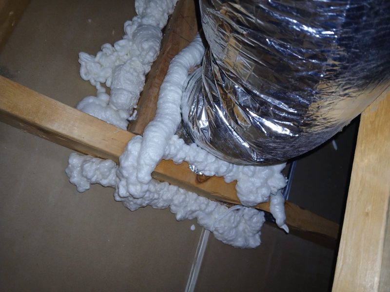 Foam bead sealing along attic joists under a flex duct