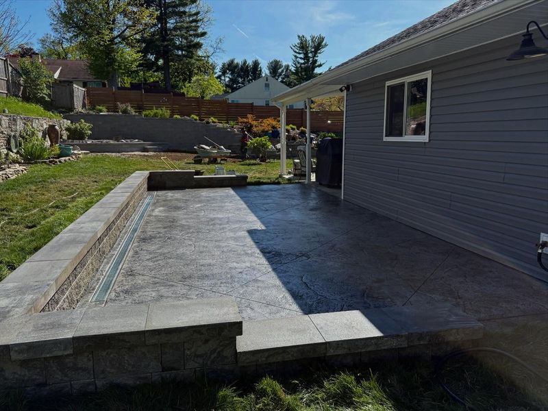 Transformative Outdoor Living: AWG Builds & Renovations Elevates Backyard Retreat with Stunning Retaining Walls and Patios