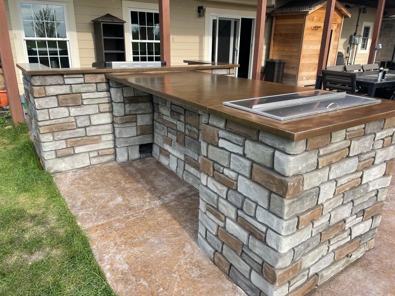Outdoor kitchen and living spaces.