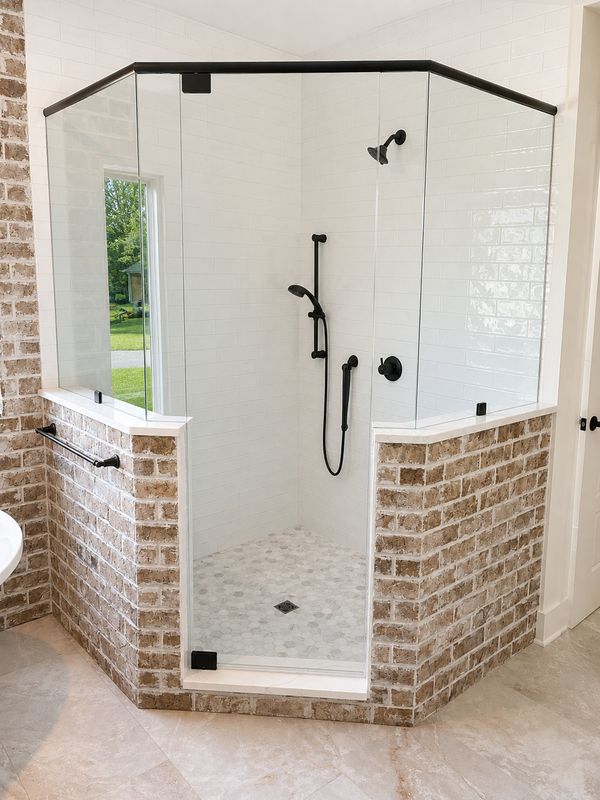 Luxurious Brick Elegance: Transforming Bathrooms with CMT Construction LLC