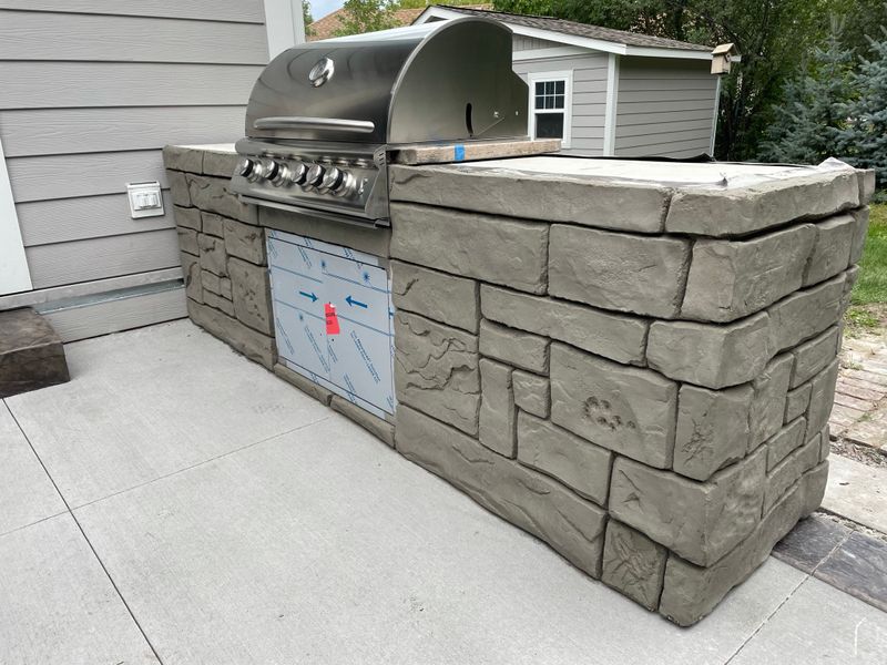 Outdoor kitchen and living spaces.