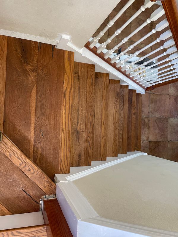 Seamless Elegance: Transforming Staircases with Premium Hardwood Flooring