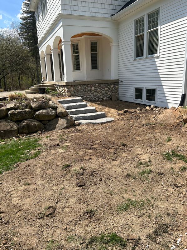 Large-Format Stone Steps Built for Patio Access and Flow